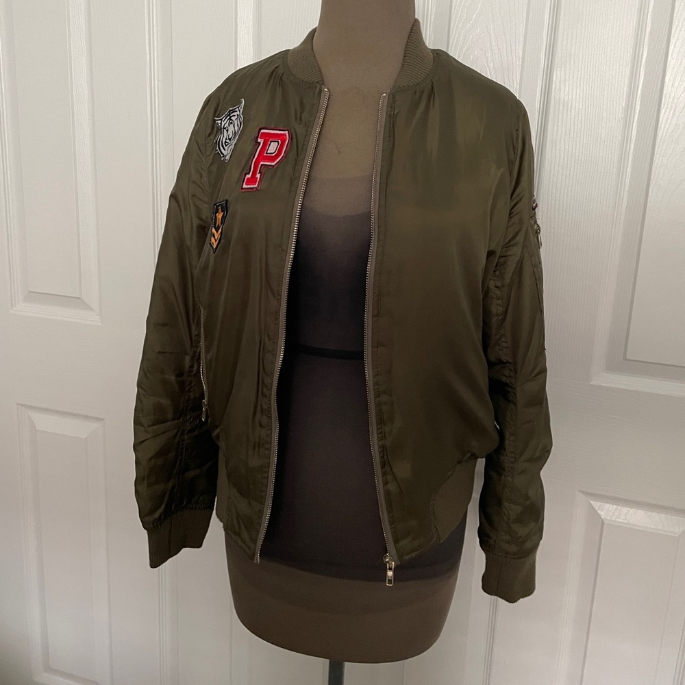 Dark green bomber jacket with patches